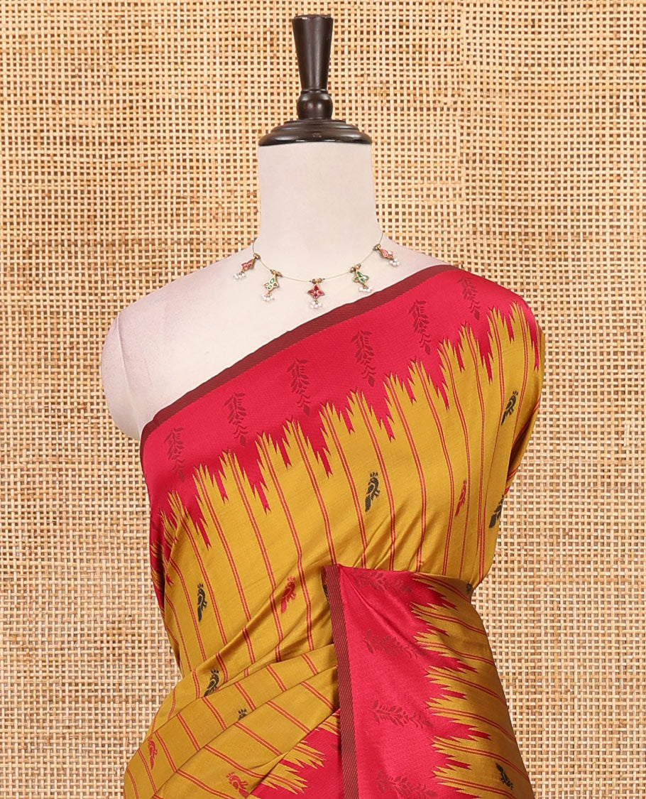 Mustard vertical striped & parrot motifs kanchi silk saree, contrast satin temple border, zari-rich jaal pallu & contrast zari design blouse