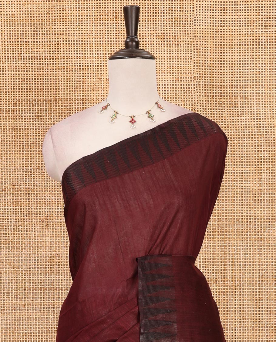Wine plain staple cotton saree, contrast temple border, striped pallu & vertical striped blouse