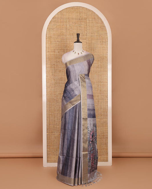 Grey vertical stripes printed hand-brush dyed Katan silk saree, gold zari bavanji border, Madhubani-style human figurines printed pallu, and floral printed blouse