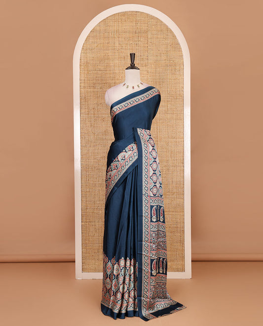 Blue plain gajji silk saree with ajrak printed border, ajrak printed geometric pallu, and printed blouse