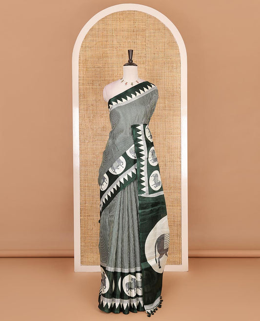 Cream-green vertically striped khadi cotton saree, contrast Pichwai cow printed temple border, Pichwai cow print pallu, and jaal printed blouse