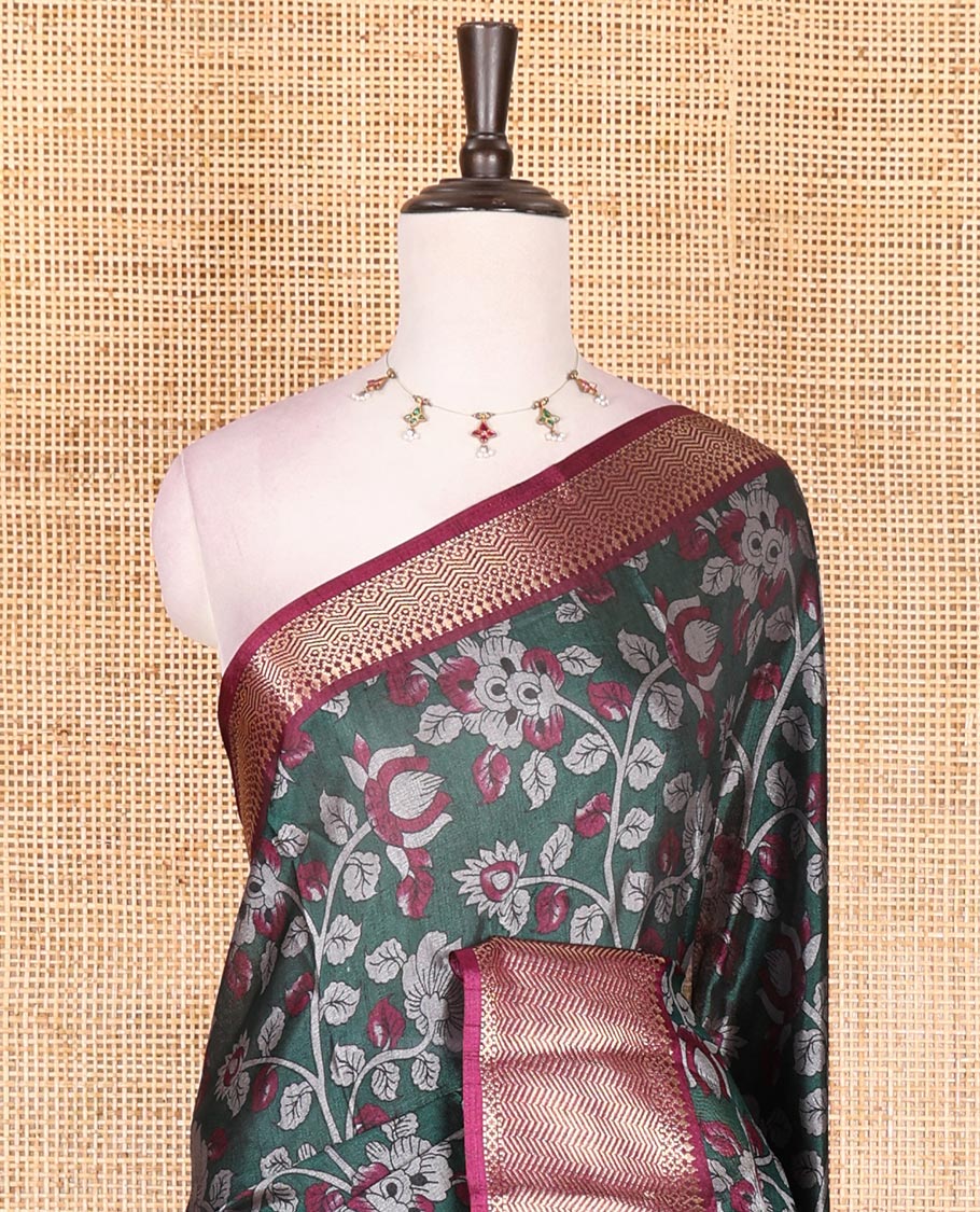 Green Kalamkari floral vine and peacock printed dola silk saree, contrast traditional zari border, peacock printed pallu, and floral vine print blouse