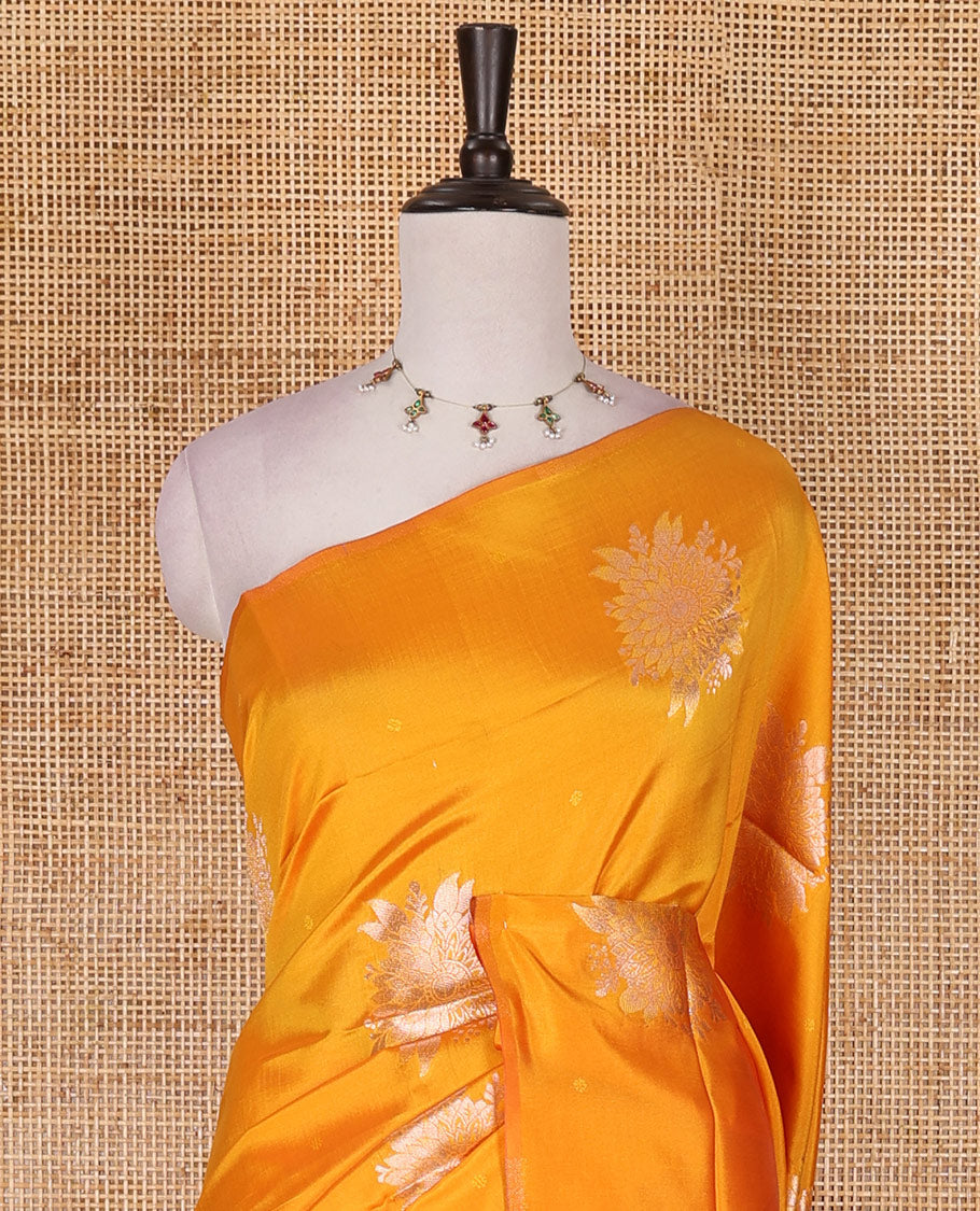 Borderless yellow floral motifs steeped elite soft silk saree, contrast lotus-like motifs pallu, and contrast buttas blouse
