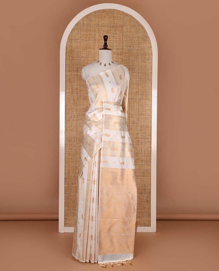 Borderless half-white traditional zari motifs steeped elite soft silk saree, floral jaal pallu, and matching zari buttas woven blouse