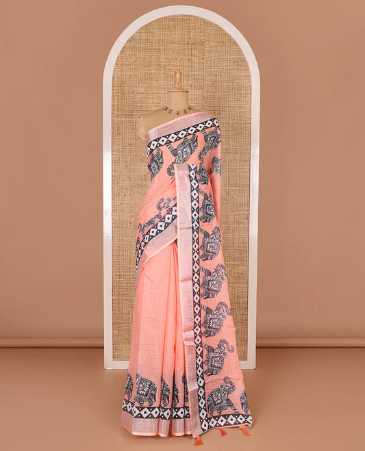 Orange plain linen cotton saree, silver zari border of elephant motifs print, elephant motifs pallu, and a contrast elephant motifs printed blouse
