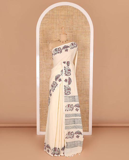 Cream plain South cotton saree, umbrella, and elephant motifs block printed border, block printed pallu, a matching blouse and a contrast floral vine block printed blouse