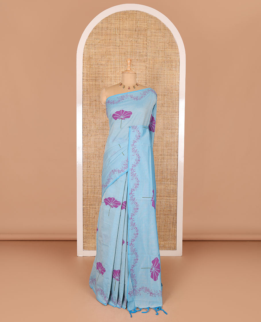 Blue lotus leaf motifs printed South cotton saree with floral creeper border, a matching blouse, and a contrast buttas block printed blouse