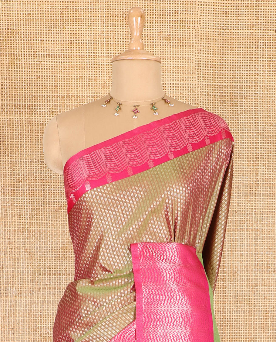 Olive green small zari buttas woven elite soft silk saree, contrast zari woven scallop satin border, jaal pallu, and a contrast chakram zari motifs blouse