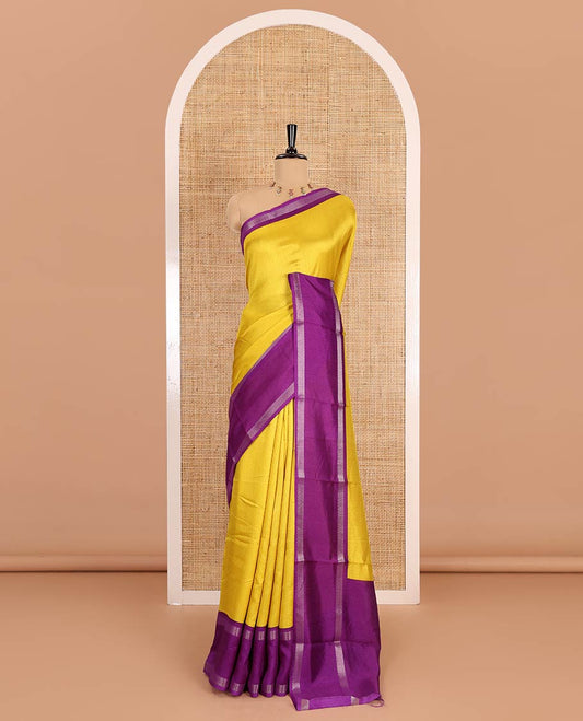 Yellow embossed moss chiffon saree, contrast traditional rettai pettu border, embossed pallu, and a contrast embossed blouse