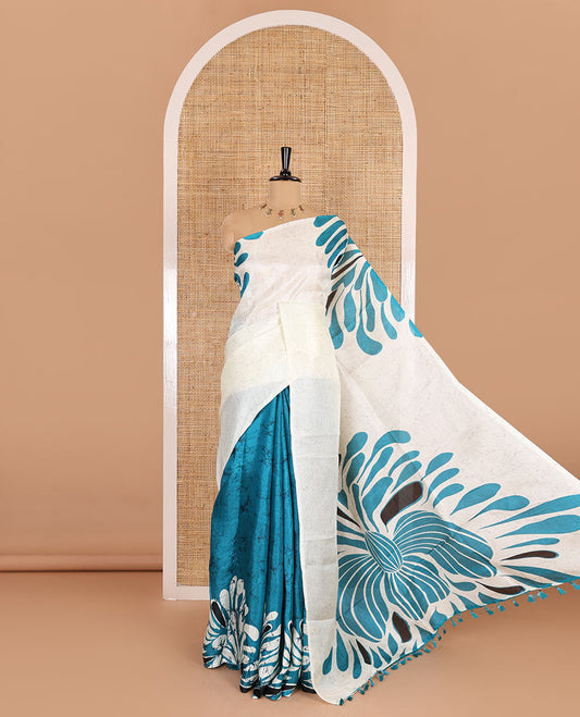 Borderless blue fancy motifs batik-printed art khadi silk saree, contrast printed pallu, and a printed blouse