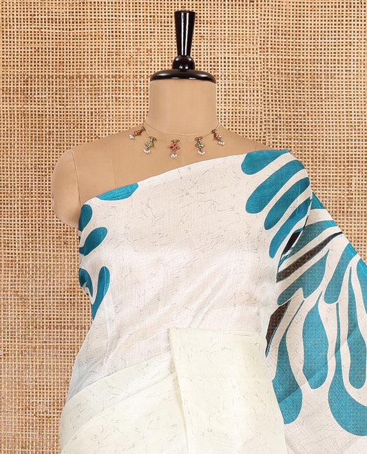 Borderless blue fancy motifs batik-printed art khadi silk saree, contrast printed pallu, and a printed blouse