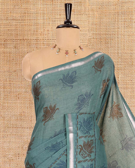 Green lotus printed soft cotton saree, piping border, printed pallu, and a shibori printed blouse of polka dots