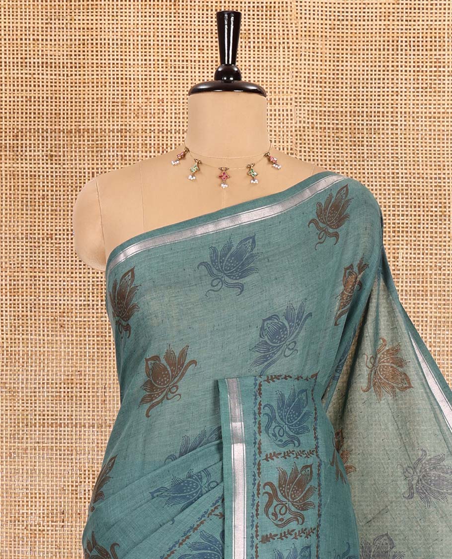 Green lotus printed soft cotton saree, piping border, printed pallu, and a shibori printed blouse of polka dots