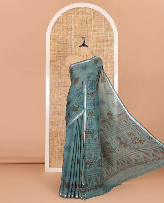 Green lotus printed soft cotton saree, piping border, printed pallu, and a shibori printed blouse of polka dots