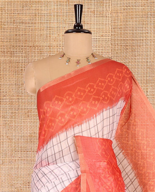 Orange checked linen cotton saree, contrast pochampally style geometric printed border, pochampally printed pallu, and a diamond patterns printed blouse