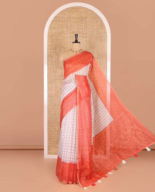 Orange checked linen cotton saree, contrast pochampally style geometric printed border, pochampally printed pallu, and a diamond patterns printed blouse