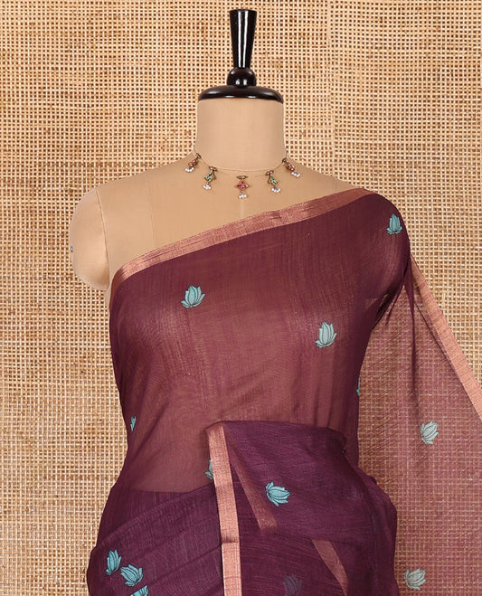 Wine lotus motifs printed linen saree, piping border, contrast floral vine printed pallu, and contrast printed blouse