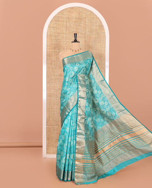 Rama lotus-leaf style printed semi-tussar saree, traditional zari border, zari striped pallu, and a matching blouse