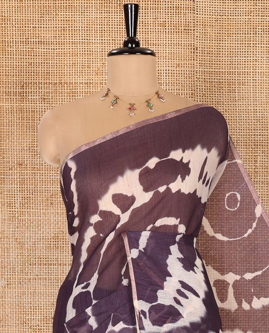 Borderless Dark Violet Linen Cotton Saree Bedecked with Shibori Prints, Complemented by Contrast Pallu Steeped with Floral Vine Print, and Paired with a Contrast Floral Printed Blouse
