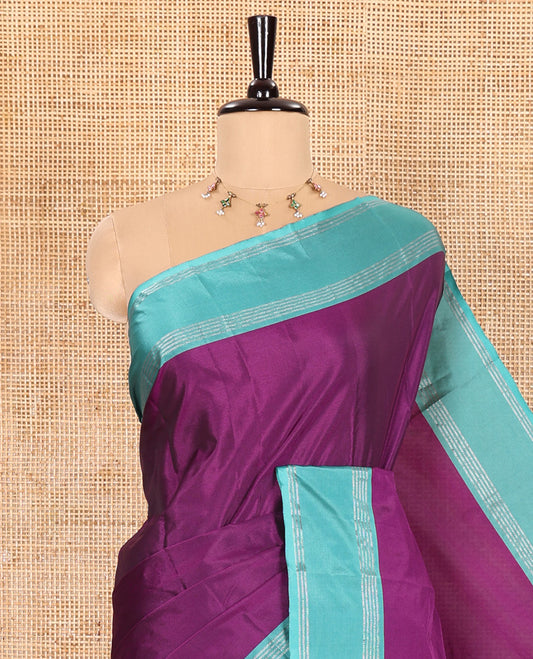 Purple Plain Semi-Soft Silk Saree, Complemented by a Contrast Zari Horizontally Striped Border, Sparsely Striped Pallu, and a Matching Blouse