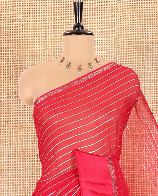 Rani Pink Viscose Georgette Saree Gleamed with Horizontal Golden Zari Stripes All Over Its Body, Accentuated by a Satin Plain Border, a Self Pallu Featuring the Same Horizontal Stripes, and Paired with a Running Blouse