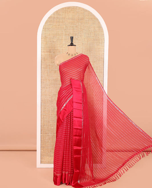 Rani Pink Viscose Georgette Saree Gleamed with Horizontal Golden Zari Stripes All Over Its Body, Accentuated by a Satin Plain Border, a Self Pallu Featuring the Same Horizontal Stripes, and Paired with a Running Blouse