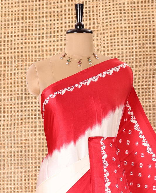 Cream and Red Satin Crepe Saree Adorned with Shibori Prints, Complemented by Contrast Shibori Printed Border, Pallu Decked Up with Shibori Prints, and Paired with a Plain Blouse