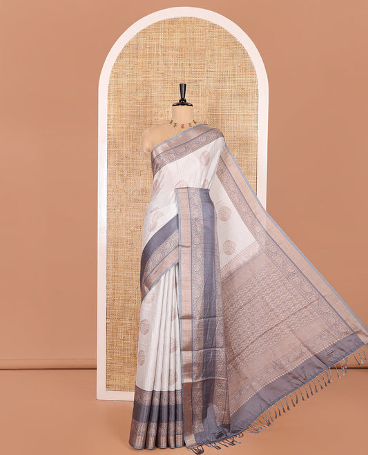 Off-White Katan Silk Saree Enthralled with Stripes and Round Buttas on Its Body, Complemented by a Contrast Border of Floral Creeper Designs, Geometric Patterned Pallu, and Paired with a Contrast Blouse