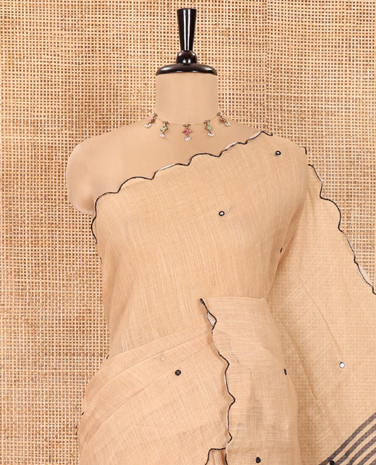 Chikku Linen Cotton Saree, Adorned with Mirror Work All Over Its Body, Subtly Scallop Border, Complemented by Contrast Pallu of Stripes and Mirror Work, and Paired with a Contrast Geometric Printed Blouse