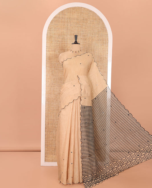 Chikku Linen Cotton Saree, Adorned with Mirror Work All Over Its Body, Subtly Scallop Border, Complemented by Contrast Pallu of Stripes and Mirror Work, and Paired with a Contrast Geometric Printed Blouse
