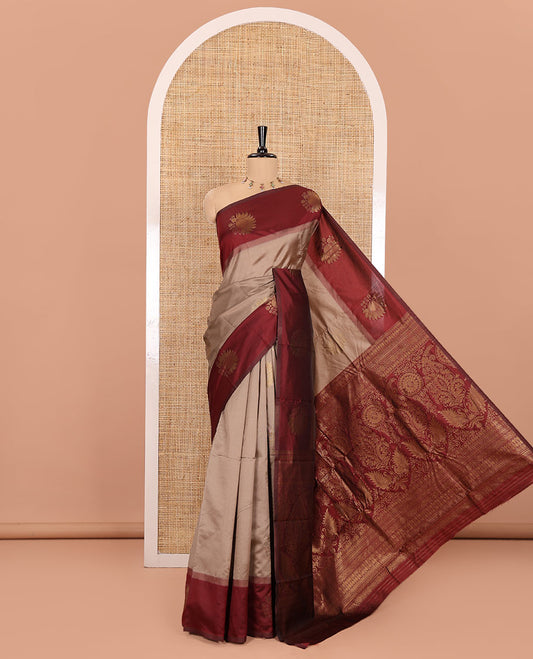 Chikku Kanchi Silk Saree, Adorned with Zari Buttas All Over Its Body, Complemented by a Contrast Border of Flower Motifs, Pallu Features Intricate Designs, and Paired with a Contrast Blouse