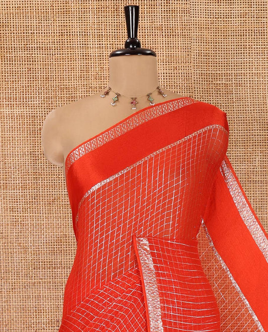 Scintillating Orange Viscose Georgette Saree Gleamed Up with Checked Design on Its Body, Highlighted by a Double-Pet Border, Zari Checked Design Pallu, and Paired with a Matching Blouse