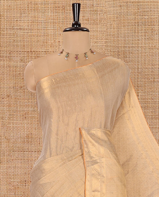 Gold Plain Tissue Mul Cotton Saree, Subtly Sparkled with Zari Border, Gleaming Zari Woven Pallu, and Paired with a Matching Blouse