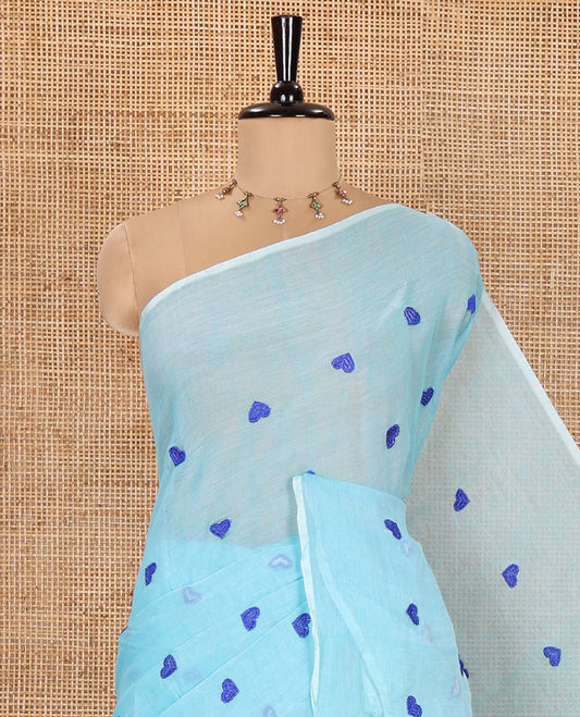 Borderless Sky Blue Khadi Mul Cotton Saree, Artfully Designed with Heart Motifs Embroidery Across Its Body, Pallu mirrors the Same Design, and Paired with a Matching Blouse