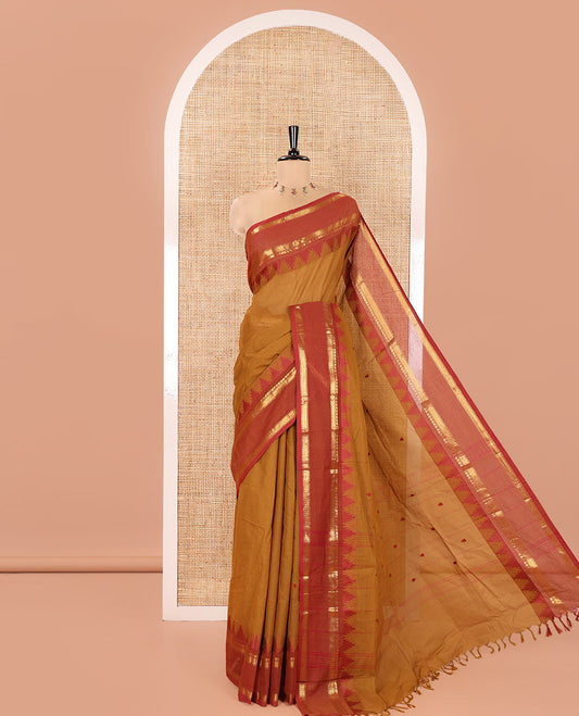 Mustard Chettinad Cotton Saree, Subtly Sparkled with Thread Buttas All Over Its Body, Complemented by a Contrast Border Rettai Pettu Border of Paisley and Chevron Stripes, Subtly Designed Pallu, and Paired with a Matching Blouse