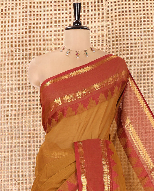 Mustard Chettinad Cotton Saree, Subtly Sparkled with Thread Buttas All Over Its Body, Complemented by a Contrast Border Rettai Pettu Border of Paisley and Chevron Stripes, Subtly Designed Pallu, and Paired with a Matching Blouse