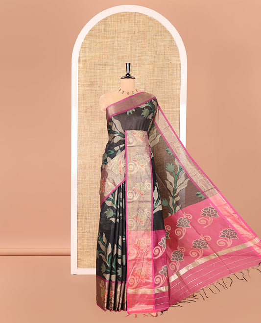 Black Chanderi Cotton Saree, Adorned with Pochampally-Style Leaf Designs on Its Body, Complemented by a Contrast Border of Rose Floral Designs in Zari, Pallu of Colorful Floral Designs, and Paired with a Contrast Blouse