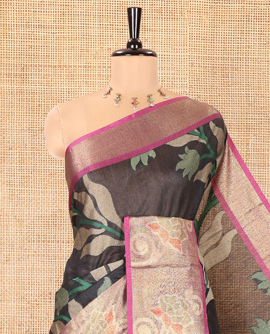 Black Chanderi Cotton Saree, Adorned with Pochampally-Style Leaf Designs on Its Body, Complemented by a Contrast Border of Rose Floral Designs in Zari, Pallu of Colorful Floral Designs, and Paired with a Contrast Blouse