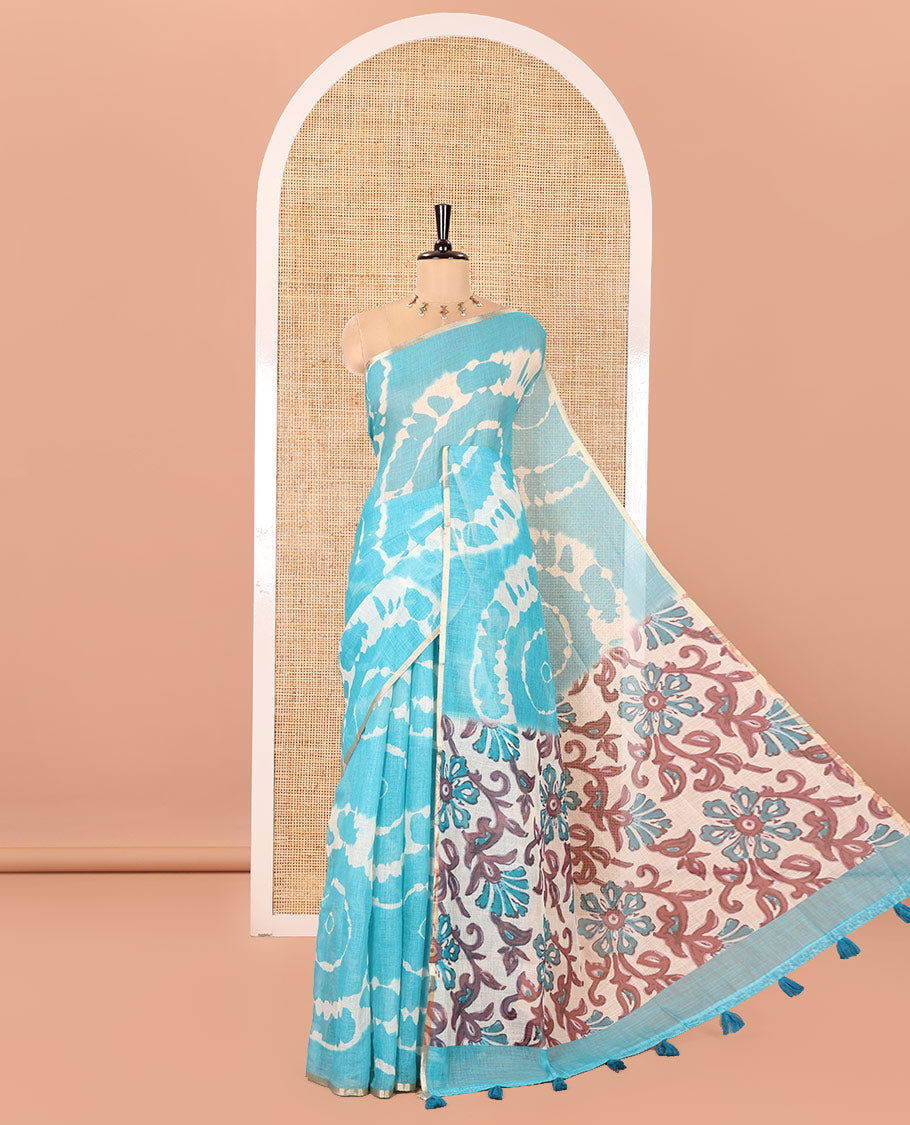 Borderless Blue Linen Cotton Saree, Bedecked with Shibori Printed on Its Body, Complemented by Contrast Floral Printed Pallu, and Paired with a Contrast Floral Printed Blouse
