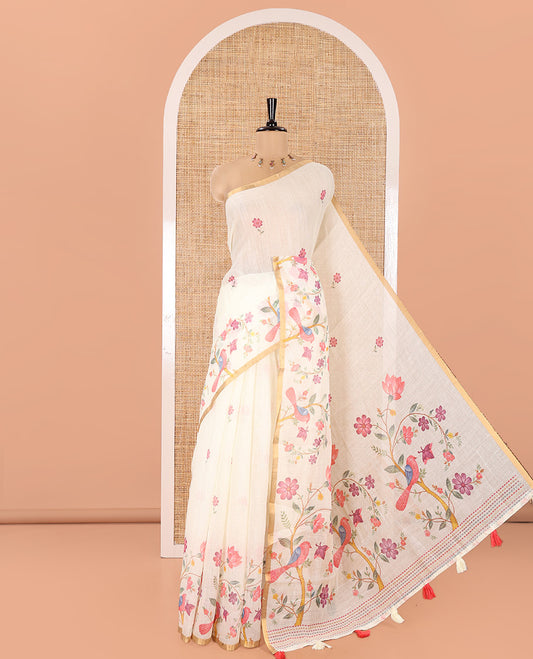 Cream Linen Cotton Saree, Artfully Detailed with Flower Motifs Printed On Its Body, Highlighted by Zari Piping Border of Floral-Bird Motifs Print,  Pallu of Same Print, and Paired with a Printed Blouse