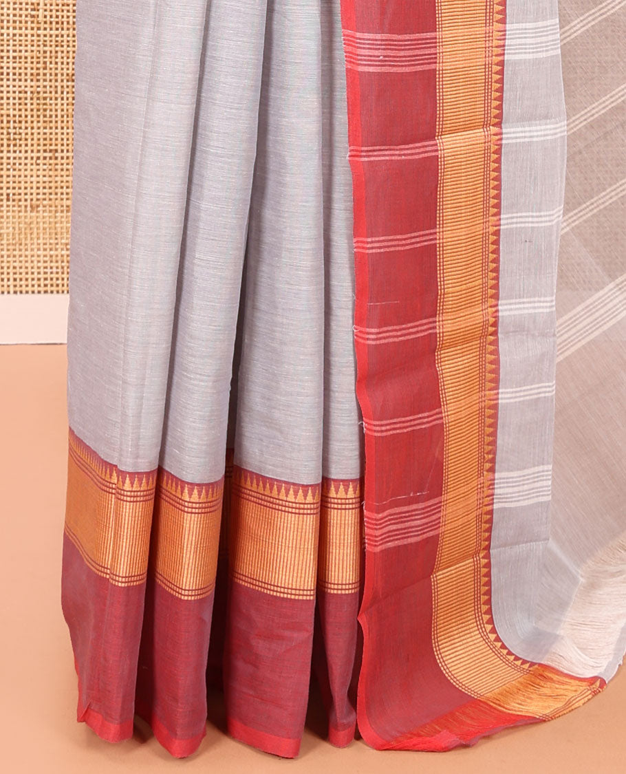 Grey Plain Chettinad Cotton Saree, Complemented by a Contrast Kal Eragina Traditional Temple Border, Subtly Striped Pallu, and Paired with a Matching Blouse