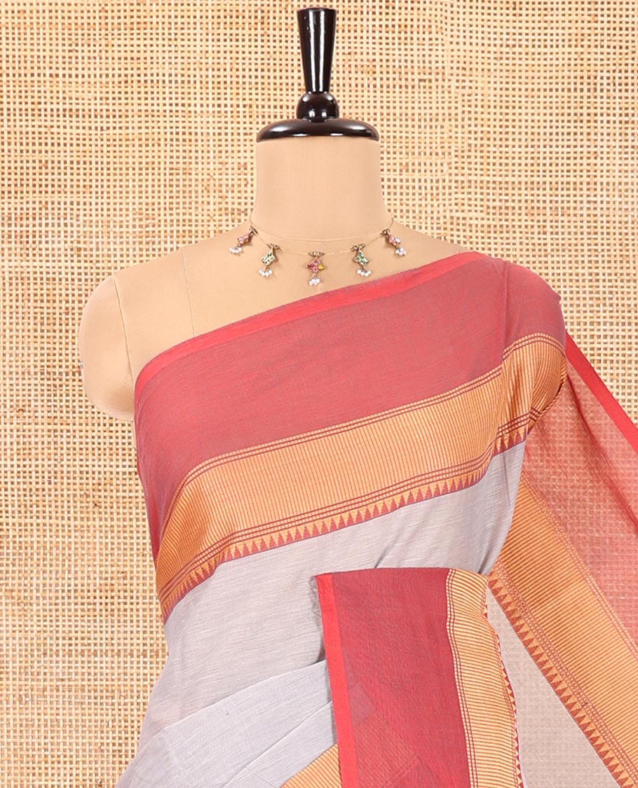 Grey Plain Chettinad Cotton Saree, Complemented by a Contrast Kal Eragina Traditional Temple Border, Subtly Striped Pallu, and Paired with a Matching Blouse