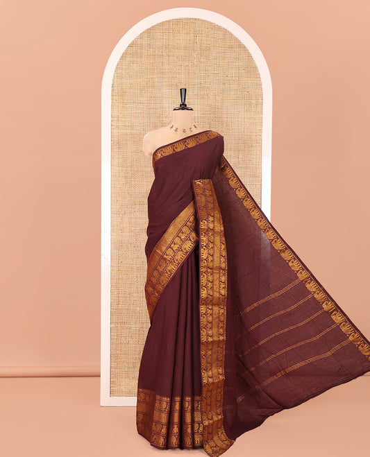Coffee Brown Plain Sungudi Cotton Saree, Highlighted by Traditional Zari Border of Peacock and Elephant Motifs Weave, Subtly Striped Pallu, and Paired with a Contrast Veldhari Design Blouse