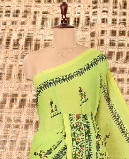 Green Khadi Mul Cotton Saree, Artfully Printed with Warli Motifs All Over Its Body, Highlighted by a Self-Border of Warli Print, Pallu of Warli Print, and Paired with a Matching Blouse