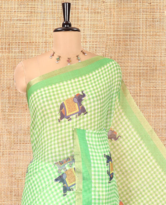 Green Linen Cotton Saree, Decked Up with Micro-Checks and Elephant Motifs on Its Body, Complemented by a Contrast Border, Striped Pallu, and Paired with a Contrast Elephant Motifs Printed Blouse