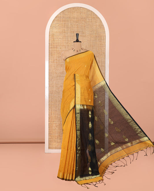 Mustard Maheshwari Cotton Saree,  Flower Buttas All Over Its Body, Highlighted by Zari Border, Pallu of Contrast Floral Buttas, and a Contrast Blouse