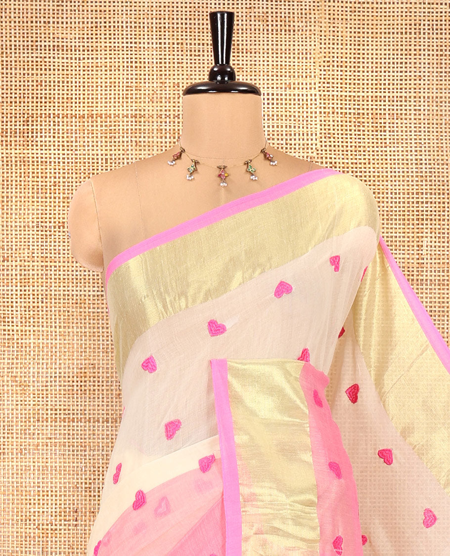Cream and Pink Khadi Mul Cotton Saree, Adorned with Half-And-Half-Style and Heart Motifs Embroidery on Its Body, a Subtle Gold Zari Border, a Self-Pallu, and Has No Blouse