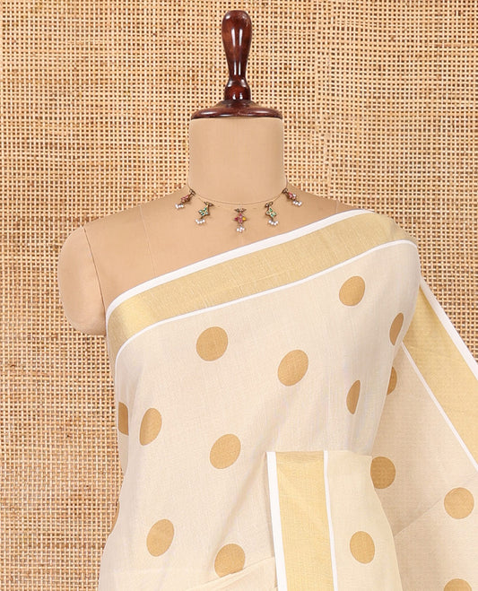 Cream Kerala Cotton Saree, Adorned with Polka Dots, a Zari Border, Pallu of Polka Dots, and a Matching Blouse