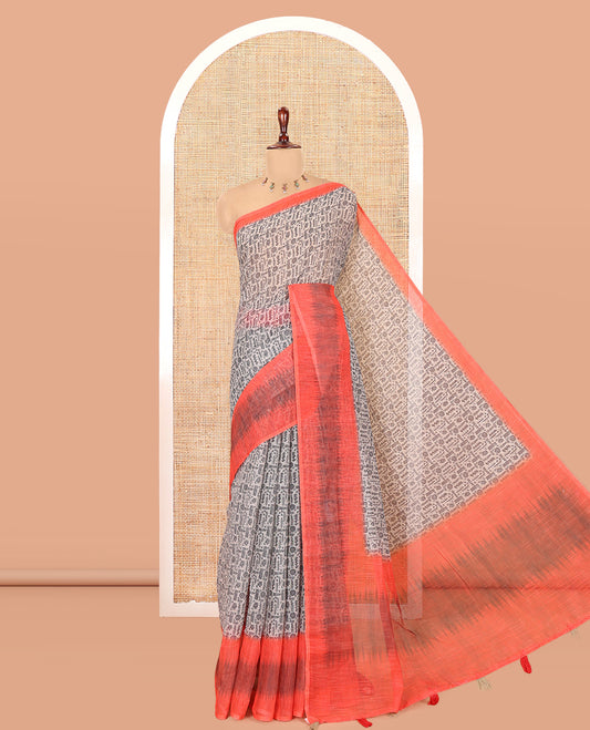 Chikku-Orange Linen Cotton Saree, Ornamented with Intricate Print, a Contrast Ikat Border, Printed Pallu, and Contrast Blouse