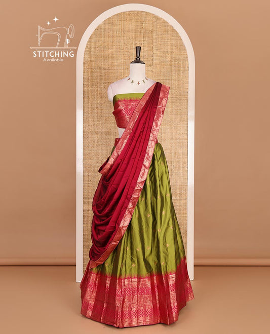 Green taffeta silk half saree, zari buttas with contrast red traditional zari border skirt, matching zari design blouse, and contrast plain zari border syska georgette dhavani